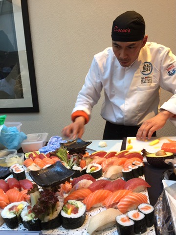 Chef Cisco preparing an extensive sushi display
