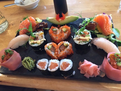 Heart-shaped sushi rolls with sashimi and maki