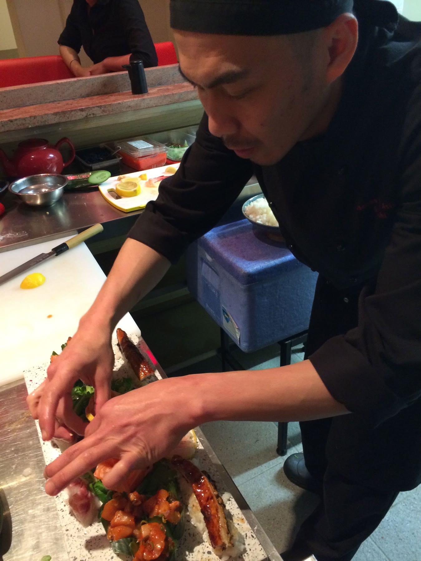 Chef Cisco carefully arranging a sushi platter